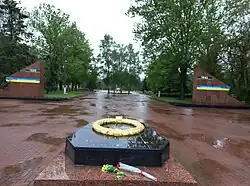 Entrance to the military cemetery «Pantheon of Eternal Glory» (inscription: The World defeated the Nazism - so Ruscism will be also defeat)