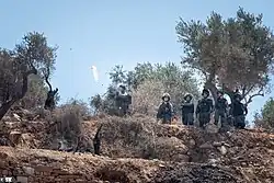 tear gas shut on protesters in Beita, July 2021