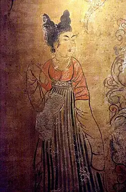 A Tang dynasty Woman wearing a red U-shaped collar banbi under her skirt.