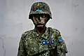 A second lieutenant of the ROCA, with cloth tapes showing rank (blue), name (given name blurred out), and branch of service, all in Chinese
