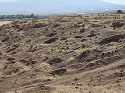 November 4, 2022. An area before the tell shows numerous pits.