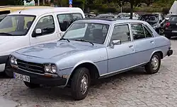 US-market Saloon with bigger bumpers, sealed-beam headlamps, and side marker lights