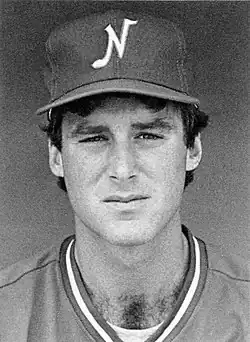A black and white photograph of a baseball player