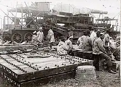 French colonial troops with site preparation materials.