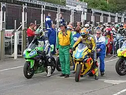 Competitors line-up in the pit-lane for the first practice session TT Grandstand Monday 20 August 2012