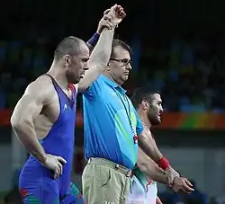 Silver medalist Khetag Gazyumov (left) and Reza Yazdani