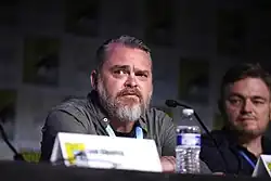 Ben Stenbeck sitting at a panel at San Diego Comic-Con 2023