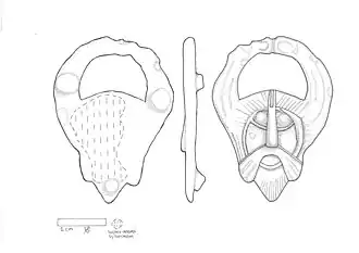 Early Anglo-Saxon gilded copper-alloy mount of bird-horned helmet figure (c. 7th century).