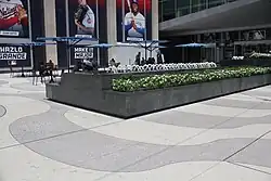 Alternating bands of white and gray tiles in the sidewalk of the plaza outside 1271 Avenue of the Americas