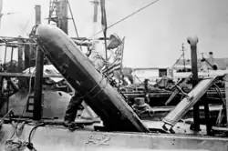 Whitehead torpedo loading into USS Adder A-2