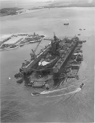 USS&nbsp;ABSD-3 at Guam ca. September 1945 repairing USS Pennsylvania (BB-38), to the rear right of ABSD-3 is the land base that supported the ABSD-6 and ABSD-3 crews
