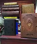 A collection of luxurious Qurans and other holy books