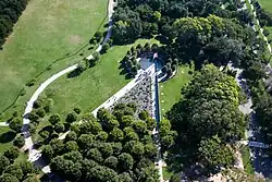 Aerial view of the triangular memorial surrounded by trees