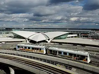 An AirTrain vehicle in front of the TWA Flight Center