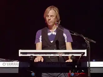 Hewitt with The Moody Blues in 2013.