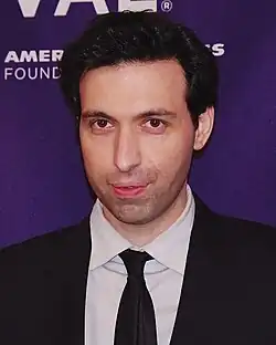Alex Karpovsky wearing a suit and tie