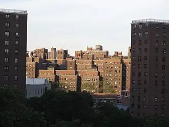 Knickerbocker Village framed by two of the Alfred E. Smith Houses towers in 2012