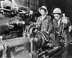 Martha Bryant and Eulalie Hampden operating a bolt cutting machine — World War II home front, Todd Shipyards, Pennsylvania, 1943