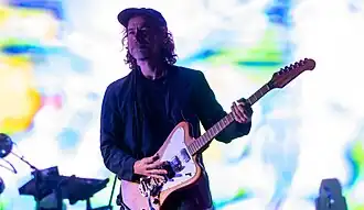 Man playing a guitar on stage