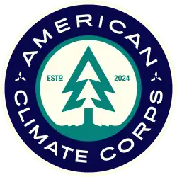 A logo of a stylized tree in a circle