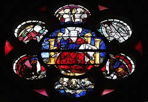 Center of the south rose window by André Robin (1451), depicting Christ in Majesty, surrounded by angels musicians, Old Men of the Apocalypse, and signs of the Zodiac