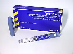 Box of Apidra SoloStar insulin pens and an uncapped pen in front
