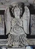 Caryatid with an angel bust on the side of the tomb