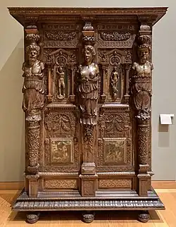 Cupboard; c. 1580; walnut and oak, partially gilded and painted; height: 2.06 m, width: 1.50 m; Louvre[163]