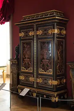Cupboard; by André Charles Boulle; c.1700; ebony and amaranth veneering, polychrome woods, brass, tin, shell, and horn marquetry on an oak frame, gilt-bronze; 255.5 x 157.5&nbsp;cm; Louvre[126]