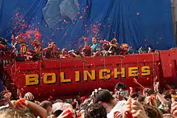 Throwing tomatoes from a truck during the Spanish Tomatina festival