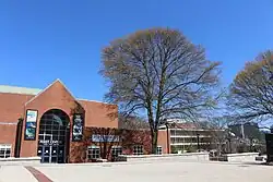 A cement plaza bordered in brick leads to the entrance to the Ferst Center for the Arts