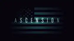 An altered American flag, barely visible in dark shadows.