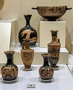 Attica lekythoi with mythological scenes and palmette motifs