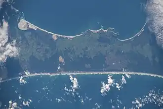 Satellite image with land in the middle third and water both above and below.