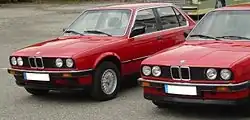 A pre-facelift (1982-1985) model parked to the left of a 1986-1987 model (first facelift).