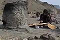 Baking bread in handmade ovens among the Baloch people