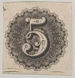 Banknote motif: number 5 against a circular panel of lace-like lathe work with a scalloped edge