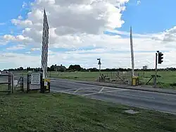 Frequent temporary closing of the barriers was required for larger aircraft movements prior to a new road being built that avoids this.