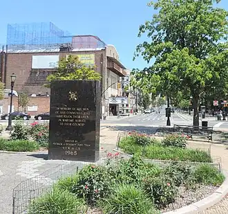 Granite columns with bronze tripods at the Prospect Park entrance