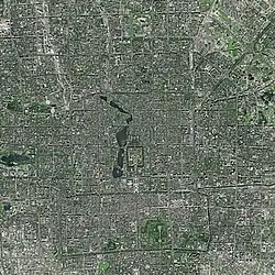 Satellite image of the city of Beijing, with the Forbidden City in the center, just north of Tiananmen Square and east of a string of lakes. Also visible are Yuyuantan lake in the west and the southern city moat, which once surrounded the walled outer city.