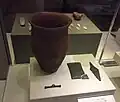 Beaker, wrist-guard with gold studs, copper dagger and toggle.[208]