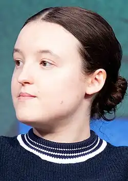 Bella Ramsey looking left