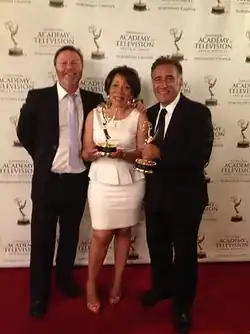 Bernadette Bascom posing for Best Human Interest Emmy win with Seattle station King 5 producers John Sharify and Douglas Burgess