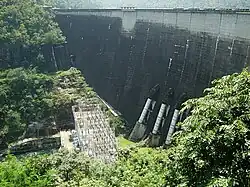 Bhumibol Dam, 154 metres (505&nbsp;ft) long, creating a reservoir with a surface area of 300 square kilometres (120&nbsp;sq&nbsp;mi).