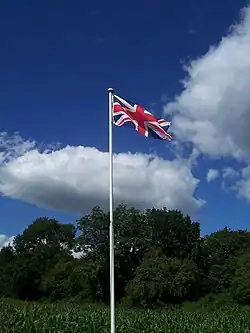 Flagpole of modest size, with simple truck (United Kingdom)