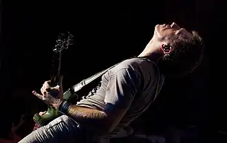 Kessler performing with Blondie during their 2010 Endangered Species World Tour