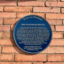 Blue plaque at the temple