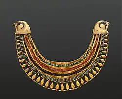 Broad collar of Senebtisi; 1850–1775 BC; faience, gold, carnelian and turquoise; outside diameter: 25&nbsp;cm, maxim width: 7.5&nbsp;cm; Metropolitan Museum of Art