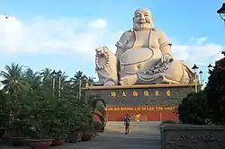 Statue of Budai at Vĩnh Tràng Temple in Vietnam