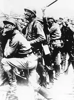 Russian soldiers on the Front of Champagne, Russian uniform and boots, and French helmets and gas masks